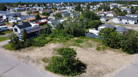 These three lots are sold together. Water and sewer services, served by the municipality, are present on each piece of land. INCLUSIONS -- EXCLUSIONS --