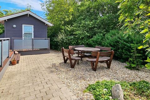 Holiday home located in the holiday home area Kærgården with a cozy garden with good shelter conditions. The house appears as a well-appointed cottage with a bright living room. Bathroom with underfloor heating and washing machine. There is a wood bu...