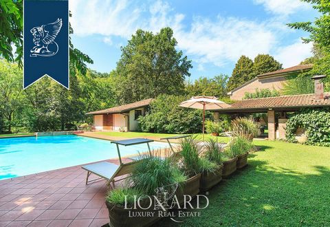 This enchanting luxury property surrounded by a green oasis is a few kilometers from Mantua. This large farm is a true natural paradise adorned with a little lake, and a stunning rose garden. The park is also home a big swimming pool equipped with a ...