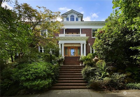 This 1915 brick Colonial Georgian home was built by Victor Voorhees for the olive oil importer John Vittucci. The interior spaces boast elegant finishes, built-in cabinetry and decorative paneling that were typical of fine homes of this period. The a...