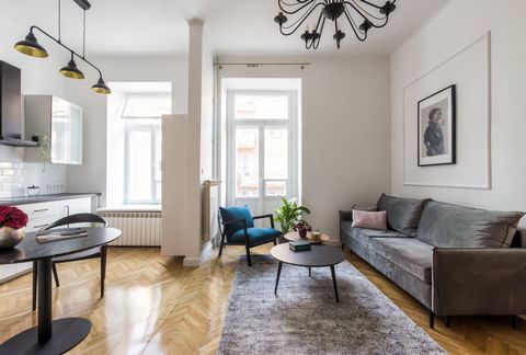 Make yourself comfortable on the soft gray sofa and drink coffee under high ceilings at this century-old retreat. This uniqe, high-end Studio has all the creative amenities a traveler can imagine. Walk down the uniquely preserved early 1910s staircas...