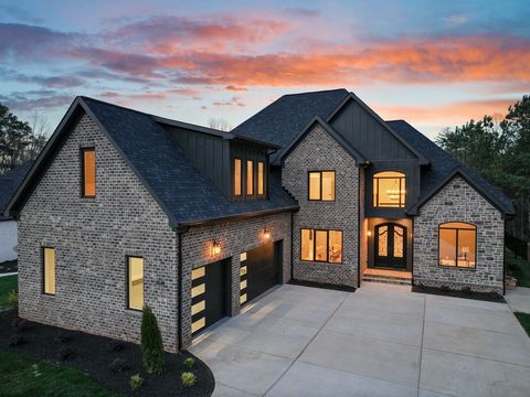 Nestled within the coveted Norman Pointe Community, this brand-new construction crafted by Prestige Homes offers over 4500 SF of opulent living space. Enter inside through double iron-clad doors to be greeted by an open floor plan and a soaring two-s...