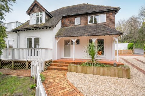 The property features a spacious bespoke open-plan kitchen dining area creating a social hub of the home, enjoying a central island and a spacious larder, along with patio doors opening onto the garden terrace, ideal for summer entertaining. The grou...
