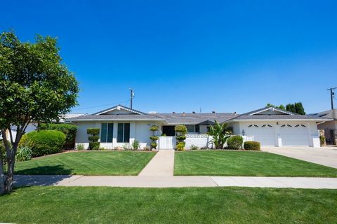 North West Fresno Beauty! A welcoming private courtyard with peaceful fountain greets you at this beautifully maintained home.Entering the home, you are greeted by views of the lovely yard with an expanse of windows and French doors that truly bring ...