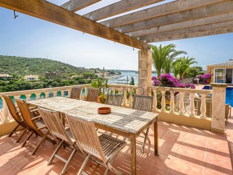 Spectacular villa with four bedrooms, four bathrooms, and a tourist licence. In the exclusive area of Cala Rata with views over the port of Mahon. The house is distributed over two plots, going up from the street, the entrance to the house is an almo...