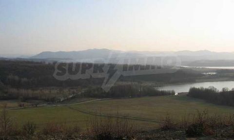 SUPRIMMO agency: ... We present for sale a land with a size of 10000 sq.m. The plot has a wonderful view of the mountain and the Yovkovtsi dam. The property has a 70 m face on an asphalt road, all communications in the property are available, with pe...