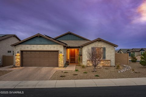 This stunning 4-bedroom retreat boasts a split floorplan, perfect for modern living. Step into elegance with majestic 10-ft ceilings, 8-ft doors, wood beams, and a 9-ft wall of glass in the bright, open Great Room. Entertain effortlessly with a custo...