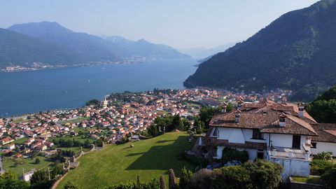 This singular lake view villa is proposed in Stazzona, on three levels above ground and one underground for a total of 650 square meters. LAYOUT Ground floor: entrance corridor, double living room with large windows overlooking Lake Como, dining room...