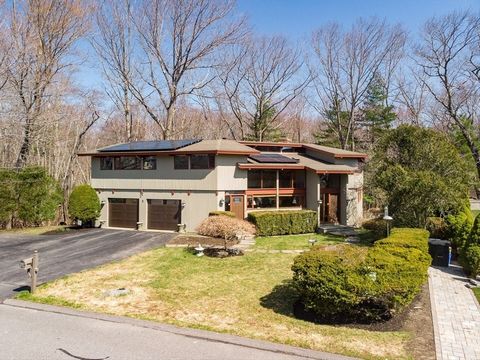 Location, Pheasants Brook Estates, one of the most sought after neighborhoods in Lexington. This 5 bedroom contemporary Deck House has over 4,400 SF of living space on 3 levels. All bedrooms are on the 2nd level. The mudroom takes you into an incredi...
