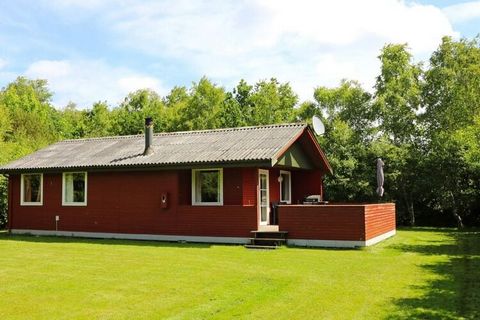 Holiday home located in a quiet area by Helberskov. There is a living room in open connection with the kitchen and access to a covered terrace. Room with double bed and room with 2 bunk beds. The house is located on a good plot with plenty of space f...