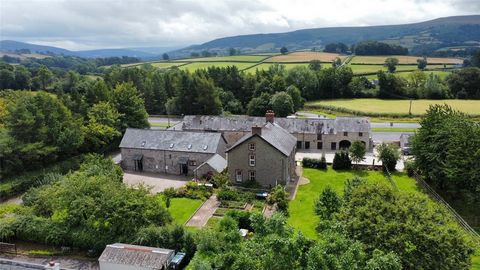 A unique opportunity to acquire 4 residential properties around a courtyard setting just one mile from Brecon and set deep in the Brecon Beacons National Park. This former farmstead comprises a large 4 bedroom detached house, a semi detached barn con...