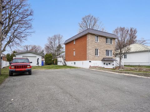 Great Duplex of two units on double lots, main level occupied by seller, second floor occupied by same tenant sinc 23 years. Fully bricked building well maintained with new 2023 roof, welded membrane and stell roof surround, two garage, one integrate...