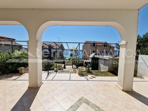 On the island of Prvic, in the beautiful town of Sepurine, a spacious apartment with a garden and a view of the sea is for sale. Located on the ground floor of a smaller apartment building, this apartment offers everything you need for a perfect vaca...