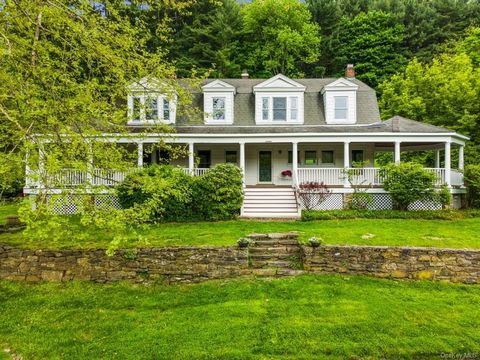 Discover the allure of this enchanting 1908 farmhouse, graced with a captivating wrap-around porch, nestled along one of the most sought after country roads, offering serene views of a picturesque pond, captivating in every season. Inside, discover a...