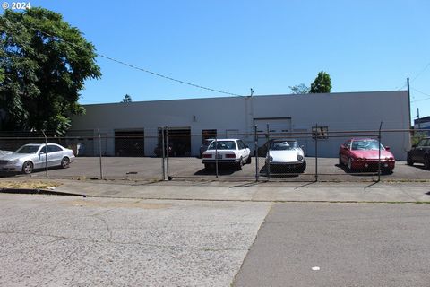 Superb location for this concrete block building Zoned CM-2 allowing a myriad of uses, buyer to verify. Includes 4 - 10' -Roll Up doors, office space ,Bathroom w/shower,equip negotiable. Fenced yard with 12+ parking spaces. Interior 14' ceilings, tor...