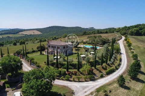 The property covers an area of about 50ha, divided into fields, olive grove and wood and consists of two independent farmhouses with 2 swimming pools, connected one another through a walkable path that goes along the olive grove. The first building c...
