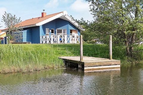 1st row. Cozy quality holiday home in Danish building style located in the Water and Landscape Park in Otterndorf. The house has panoramic windows, furniture in modern Scandinavian design and wood-paneled walls and sloping ceilings, a 4-person sauna,...