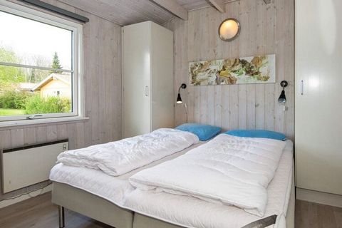 This holiday cottage is located in the charming holiday area called Pøt Strandby. The cottage has a kitchen with just all you need: for instance dish washer, fridge/freezer, cooker with ceramic cooking plates, cooker hood and microwave oven. Nice fur...