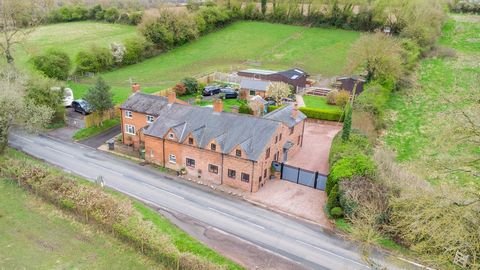 Approached down a country lane leading into the heart of the village is this beautifully presented semi-detached equestrian family cottage. The private gated entrance, to one side, leads onto the generous gravelled driveway and into the property itse...