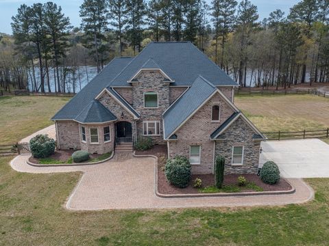 Beautiful Estate home with all the bells and whistles one can think of. 3 Bedroom home, freshly updated, with Primary on main level. The ultimate in privacy, this home is situated on 93 acres which front on a pristine lake (owned by another party) bu...
