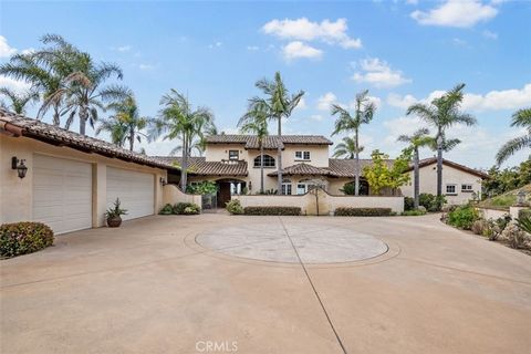 Welcome to your sanctuary of elegance and tranquility nestled in the heart of Fallbrook, offering a sophisticated Spanish Colonial retreat with breathtaking panoramic views. Step through the grand double doors into a home of impeccable craftsmanship ...