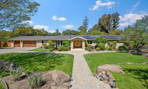 SOPHISTICATED COUNTRY AMBIANCE IN PREMIER CLOSE-IN LOCATION. This property is truly in a league of its own. Magnificent, mainly flat 1+ acre lot nestled in the Los Altos Hills with Zen-like tranquility and seamless integration of pristine landscape a...