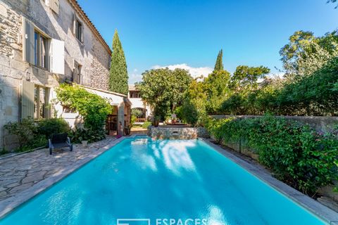 Located 15 minutes from the city center of Nîmes, this authentic village farmhouse renovated according to the rules of the art with beautiful materials, develops a surface area of 350 m2. Perfectly mastered, its renovation, which has preserved its ch...