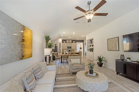 This formal model home is a testament to modern sophistication, boasting a single-story layout. Step inside to discover a spacious open floor plan that seamlessly connects the living, dining, and kitchen areas, ideal for both casual gatherings and fo...