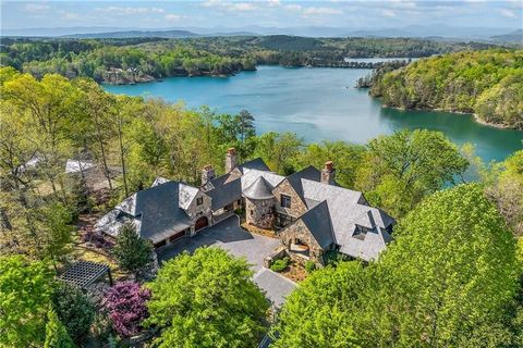 Instantly relax in the tucked away splendor of Stone Vista Manor with open, panoramic water views in The Reserve at Lake Keowee! Driving up the cobblestone courtyard, Stone Vista Manor’s massive stone arches welcome you through the foyer into the mai...