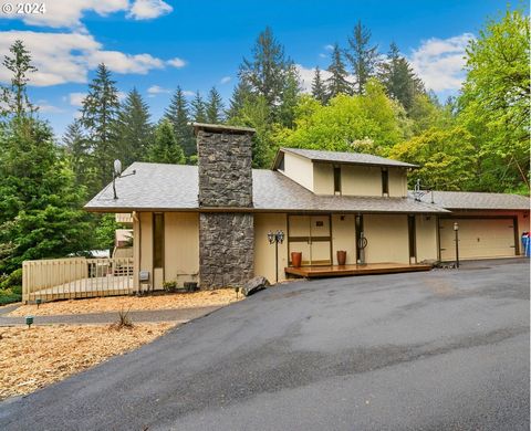 Welcome to your Mid-Century Modern sanctuary nestled on 2.55 acres of lush landscape! This stunning 2-story home boasts a captivating exterior with wood and cedar siding, complemented by an abundance of windows flooding the interior with natural ligh...