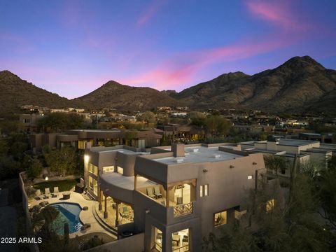 Your gated Troon Village estate retreat is finally here, w/ breathtaking sunrise and sunset views of Pinnacle Peak, Troon Mountain, and twinkling Scottsdale city lights.The grand entry sets the tone with 14-foot ceilings, leading into a spacious livi...