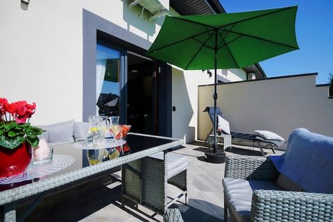 On the edge of a charming seaside settlement, there is a family holiday resort, which offers accommodation in two-story terraced houses and plenty of green space for children to play various games and have fun. Two-story holiday homes with terraces a...