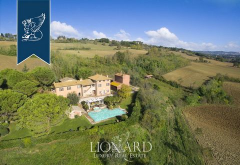 This splendid villa for sale is located in the heart of Umbria, near Perugia and the Wine Route, in Umbria, a region which is home to some of the best known works of art by Giotto, Cimabue, and Benozzo Gozzoli. The farmhouse, currently used as an acc...