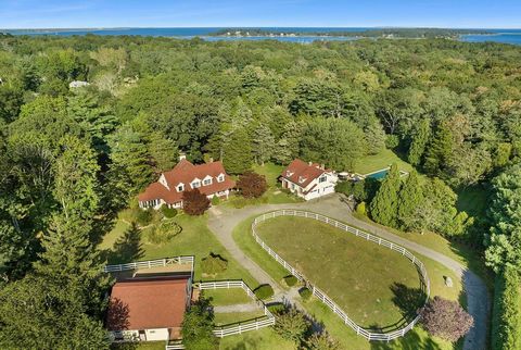 This meticulously crafted Shelter Island 8.12 +/- acre estate property is currently configured with 3 substantial structures: a 3 bedroom, 4 bath primary residence, a 2-car carriage house with loft apartment, and a 3-stall horse barn with tack room a...