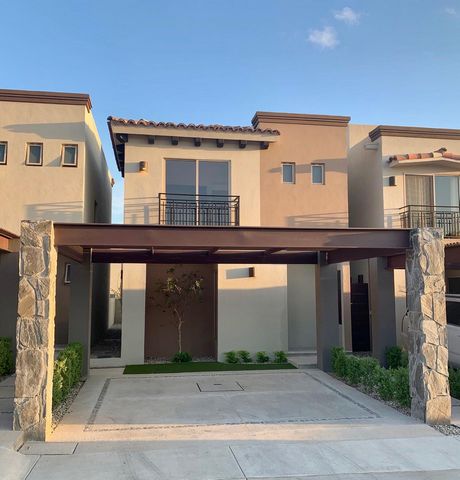 This modern house in Los Cabos boasts a sleek and contemporary design with clean lines and an emphasis on natural light. The open floor plan allows for a seamless transition between the living dining kitchen and garden areas creating a spacious and i...