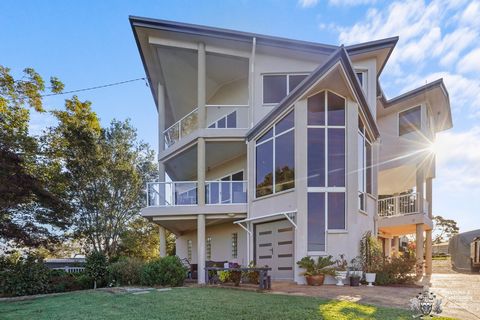 Experience breathtaking coastal vistas from nearly every room of this impeccably presented 3-bedroom architecturally designed residence, now at a new price! Marvel at the panoramic spectacle stretching from Moreton Bay to N.S.W., with the picturesque...
