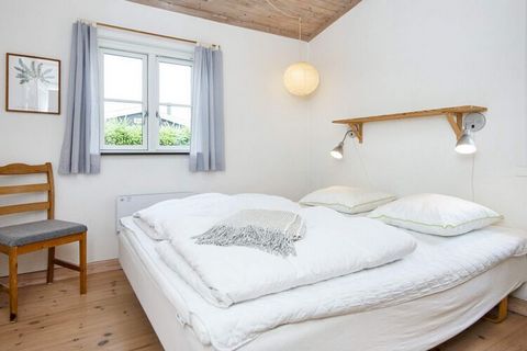 Not far from the good bathing beach in Høll is this slightly older, renovated cottage. The house is furnished with a small conservatory, from which there is access to the garden, which is secluded. Not for rent to youth groups.