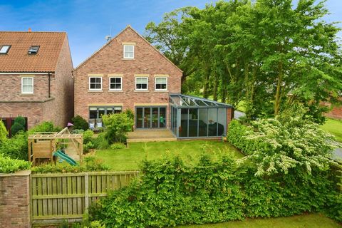 Guide price £475,000 - £525,000 Check out the video! Exclusive Five-Bedroom Residence in Prestigious Newbald Development Fine and Country is proud to present an exquisite, five-bedroom residence in the distinguished village of Newbald, beautifully lo...