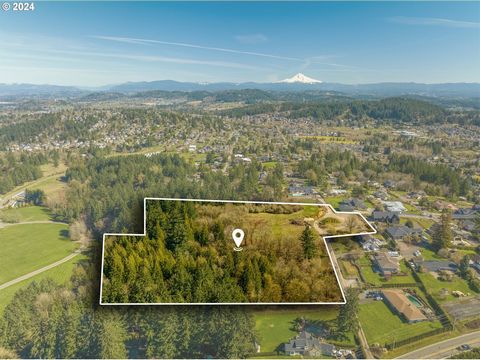 Welcome to 12040 SE Mt Scott Blvd, nestled atop the picturesque landscapes of Happy Valley. The opportunity to own over 7 acres with a view in Happy Valley is so rare, just minutes from the park, freeway and local businesses but with the peace and qu...
