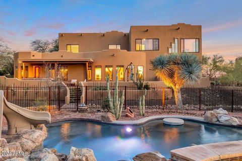 Welcome home to this exceptional custom-built estate, accompanied by a guest home and a wonderful pool! Summer comfort awaits with the Newer HVAC's on the main home and SOLAR to be PAID IN FULL at COE! Situated on over and acre of maintained desert l...