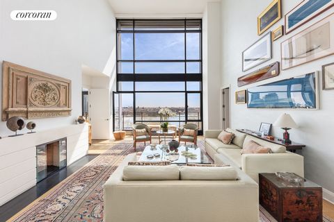 This magnificent loft-like duplex features three bedrooms, three ensuite bathrooms and an elegant powder room. The dramatic living room boasts a 21' foot ceiling, mezzanine and gas fireplace. Floor-to-ceiling windows and five balconies afford unobstr...