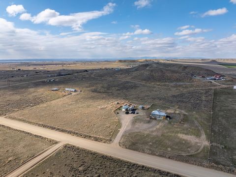 This property is located approximately 8 miles North West of Riverton, Wy. Nestled on 10 acres this property offers a 3 bed & 2 bath home, shop, multiple outbuildings and plenty of room for livestock all compiled into the simple life of rural living....