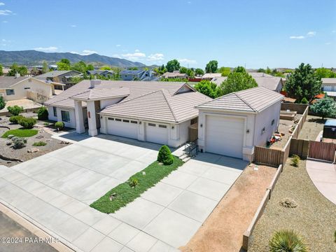 Welcome to your new home at 13293 E Remington Rd, nestled in Mingus West, a vibrant and growing community of Prescott Valley, AZ. This exquisite single-level house offers a spacious layout covering 2,571 SF, encompassing four well-appointed bedrooms,...