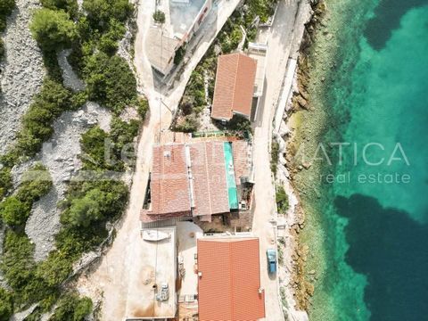 Žirje, house first row by the sea. The house is located in a beautiful position in the cove. The house was built in cascade. It consists of basement, ground floor and attic. In the basement there is a one bedroom apartment of approx. 40 m2 with acces...