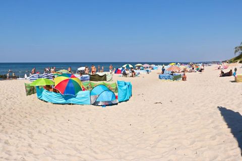 On the edge of a charming seaside settlement, there is a family holiday resort, which offers accommodation in two-story terraced houses and plenty of green space for children to play various games and have fun. Two-story holiday homes with terraces a...