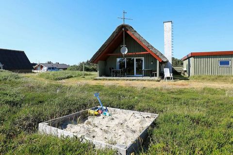 Well equipped holiday cottage with enclosed terrace facing south and overlooking the dunes and Nr. Lyngvig lighthouse. The mezzanine on the 1st floor is big enough for you to stand upright. The house is located on a 1,200 m² large dune plot in a scen...