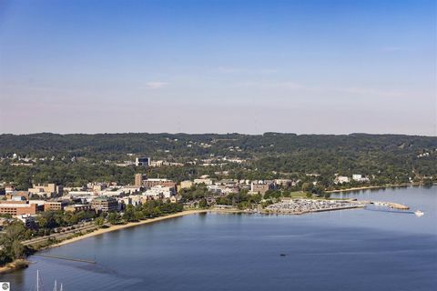 NEW CONSTRUCTION in Traverse City! Take advantage of first phase pricing for this very popular plan with a balcony facing beautiful West Bay. Only 14 Units in this first step with 2 & 3 bedroom options available. This is condo living at its finest wi...