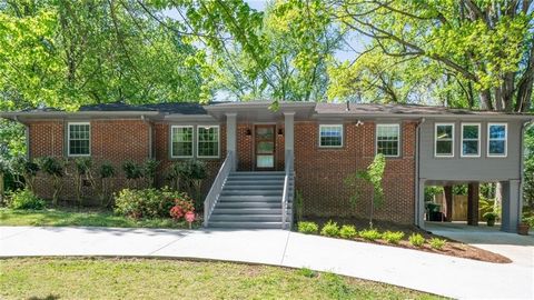Discover the allure of this truly magnificent mid-century 3-sided brick ranch nestled in the sought-after Toco Hills neighborhood. Boasting a prime location close to I-85, this home is a gem waiting to be cherished. Step inside to be greeted by a spa...