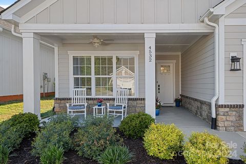 Welcome to this gorgeous spacious and light filled home in Magnolia Cove! Walking in from your covered front porch, you'll notice the ideal open floor plan that leads to your chef's kitchen with quartz countertops, oversized island, soft close cabine...