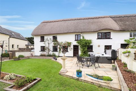 Discover this enchanting four bedroom Grade II listed thatched cottage, exuding charm and character, nestled within a picturesque rural area between South Molton and Barnstaple. Enjoying grounds of approximately 1 acre, the cottage has undergone sign...